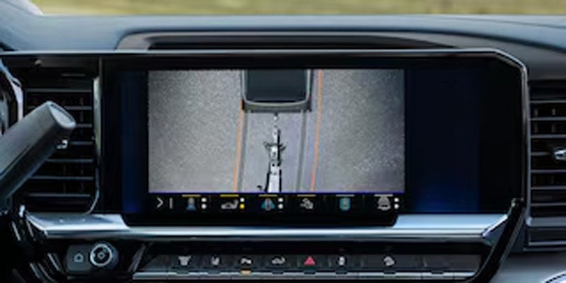 Chevrolet Silverado infotainment screen showing rearview camera with trailer assist lines.