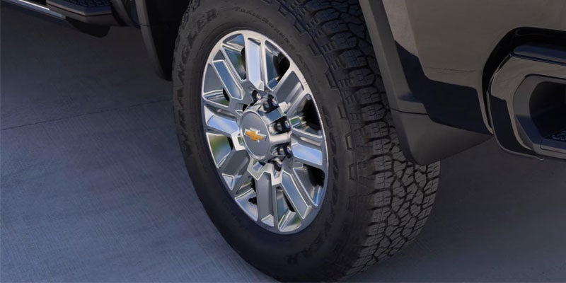 Close-up of Chevrolet Silverado truck wheel and tire.